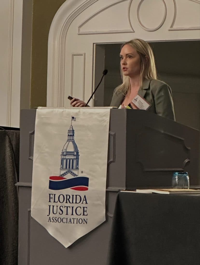 An attorney speaking at a legal association event