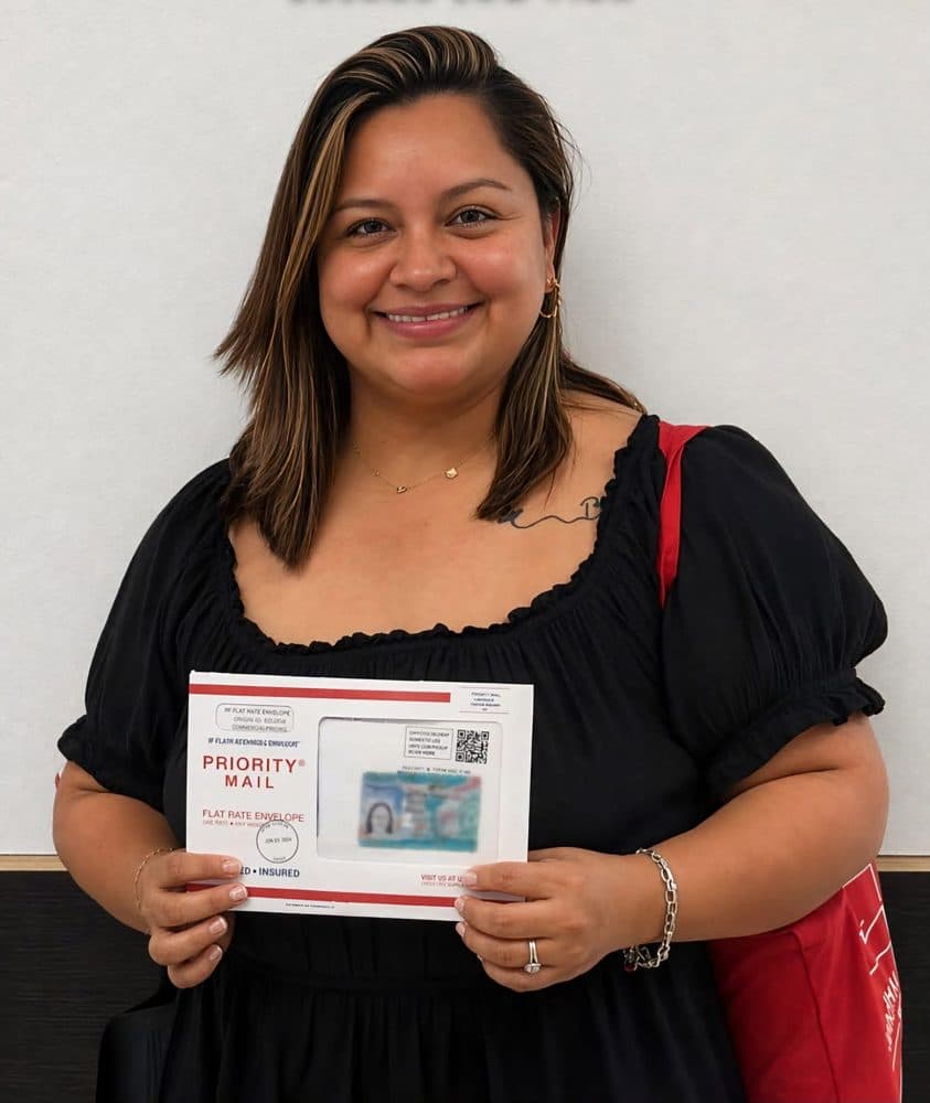 A client holding approved paperwork after their matter
